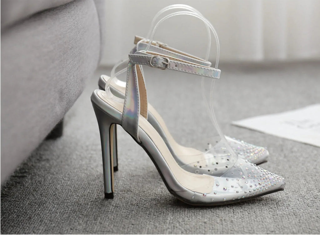 Women's pointed-toe stiletto sandals with a diamond detail on the PVC upper.