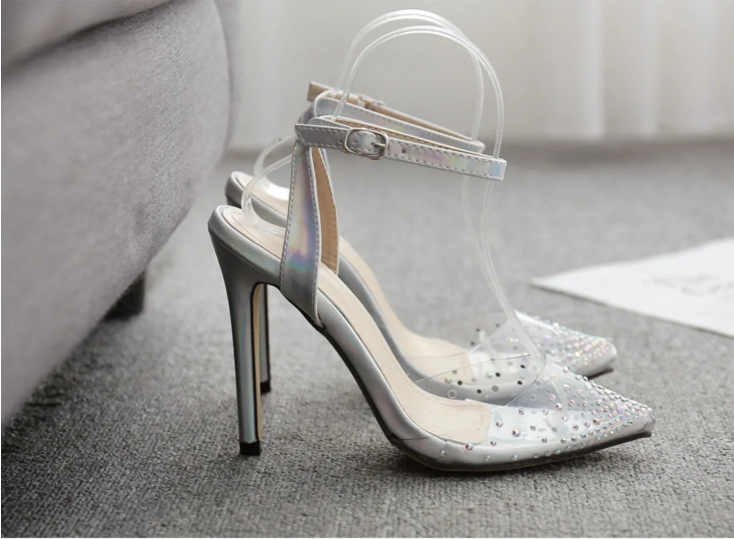 Women's pointed-toe stiletto sandals with a diamond detail on the PVC upper.