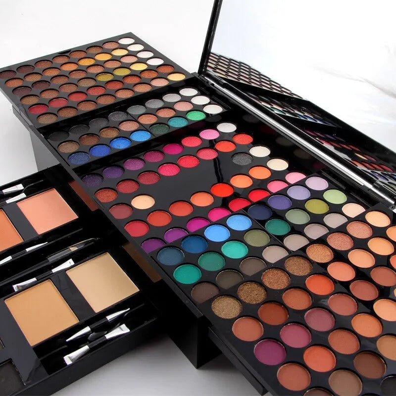 Piano-shaped open makeup palette displaying 180 eyeshadow colours, 2 blushes, 2 powders, and 6 powder outlines.