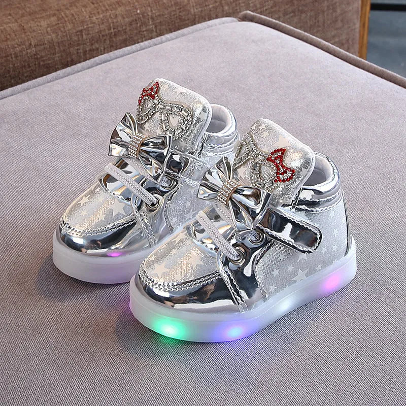 Children's LED trainers with magic button and illuminated soles in golden, pink or silvery colours
