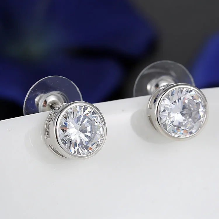 Bridal pendant and earring set with diamond-cut metal alloy finish on white background
