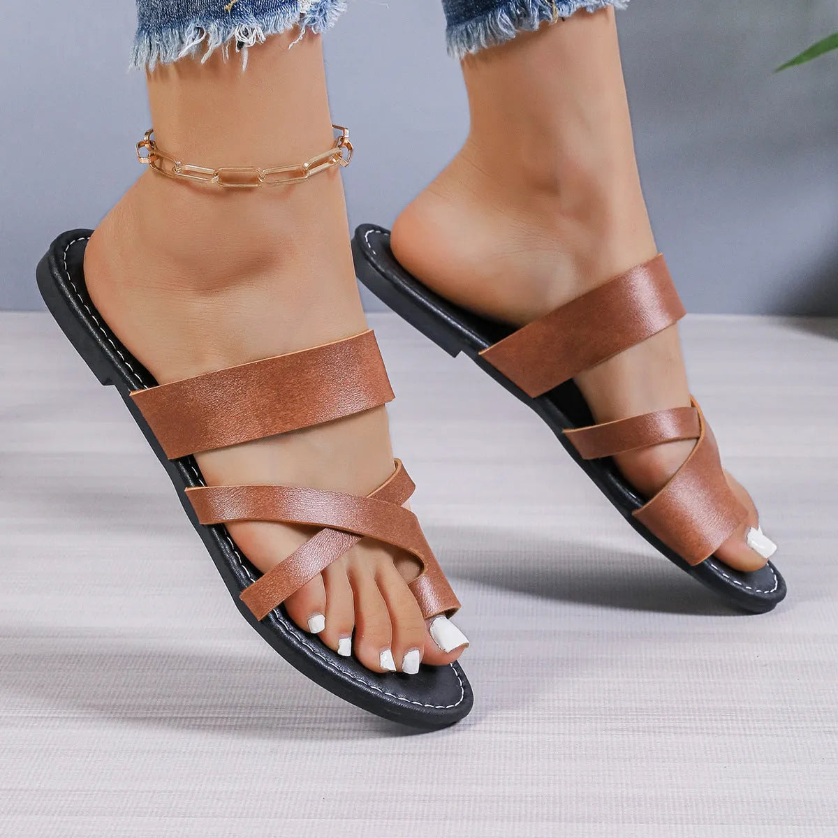 Casual round toe beach slippers with hollow-out pattern and rubber sole in black, brown, or wine red.