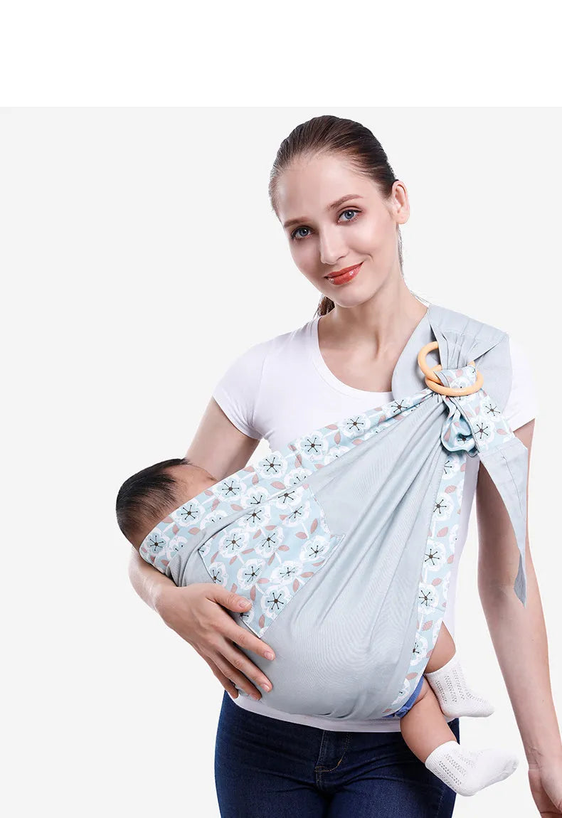 Adjustable baby wrap carrier sling shown in multiple colours, suitable for infants 0-36 months.