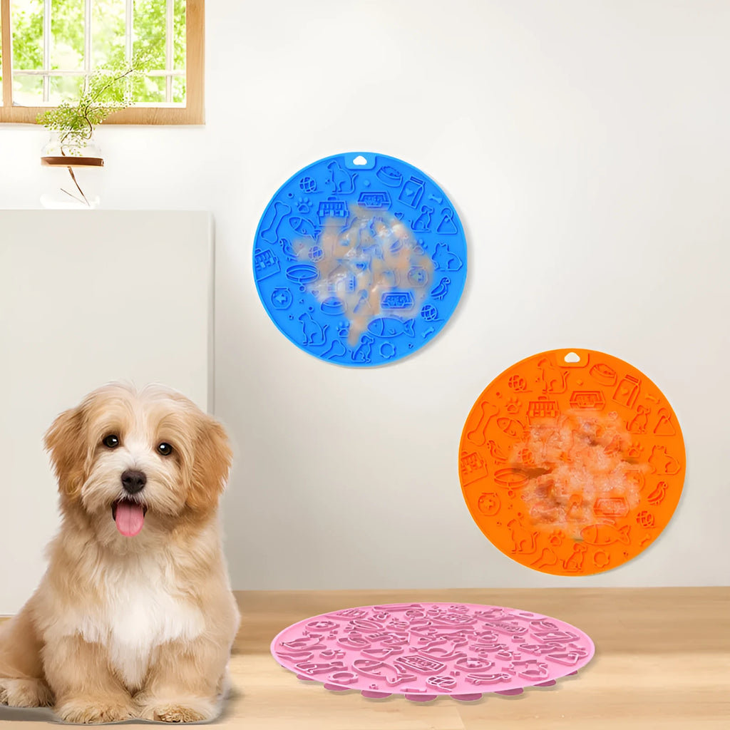 Round blue silicone pet licking mat with textured surface and a clear sucker base on the bottom.