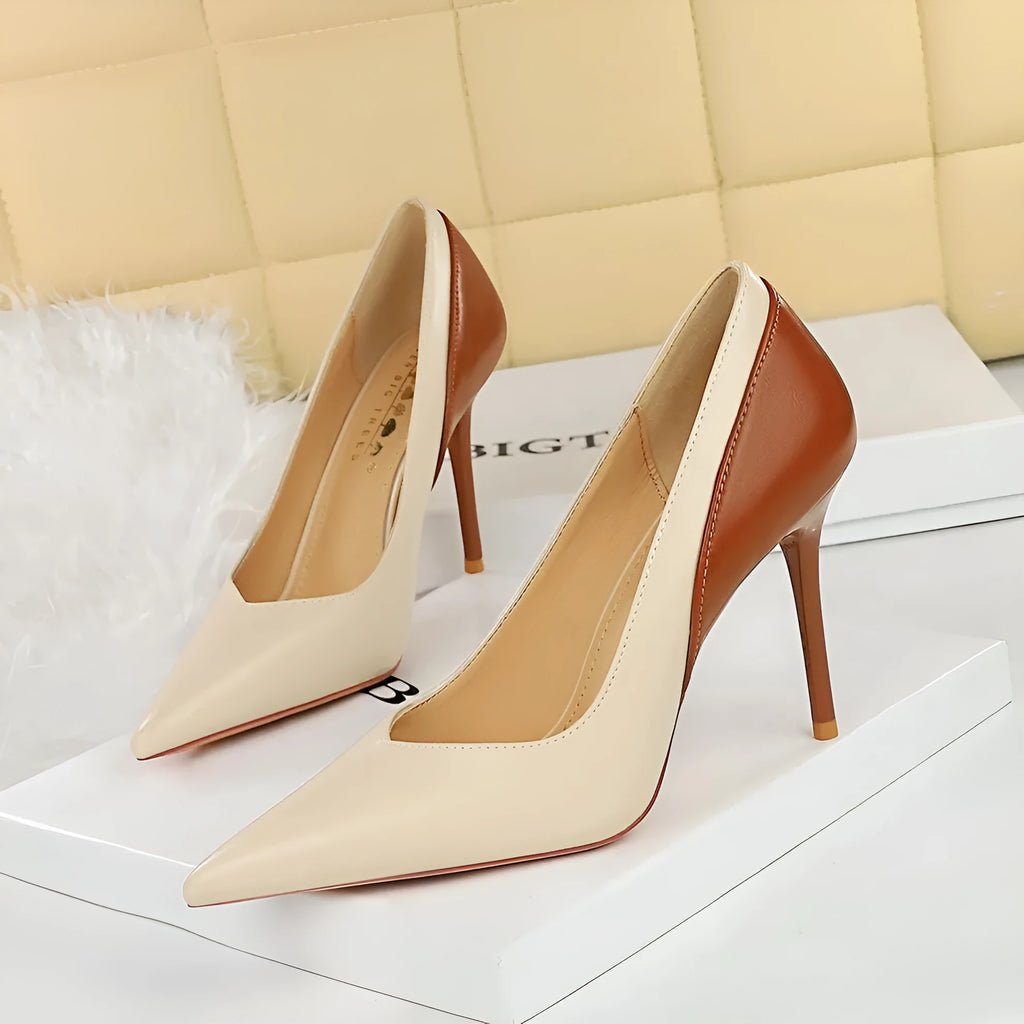 Retro-style black and creamy white women's stiletto high heels with pointed toe for banquet wear.