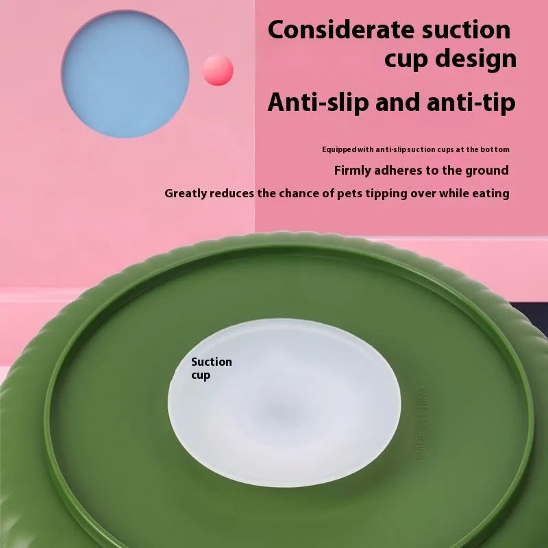 Grey rotating pet bowl with a windmill-pattern silicone licking mat insert for slow feeding.