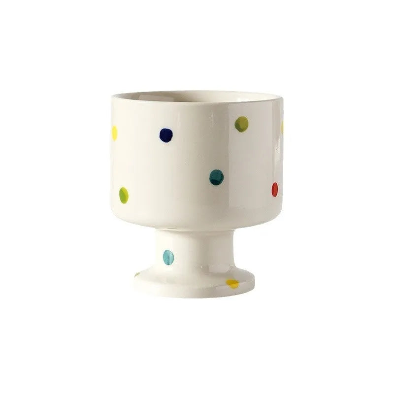 Hand-pinched irregular ceramic mug in solid colour with modern simple design