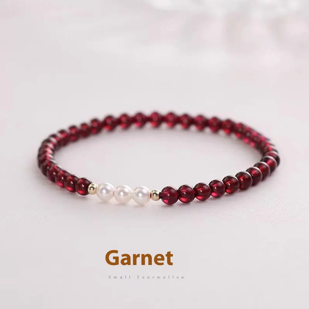 Women's crystal bracelet with Chinese garnet beads and artificial pearls on wrist