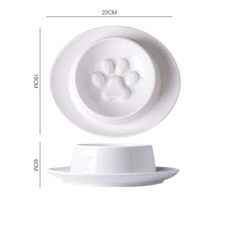 Green ceramic slow feeder pet bowl with central anti-choking basin on a white background.