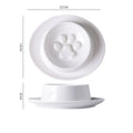 Green ceramic slow feeder pet bowl with central anti-choking basin on a white background.