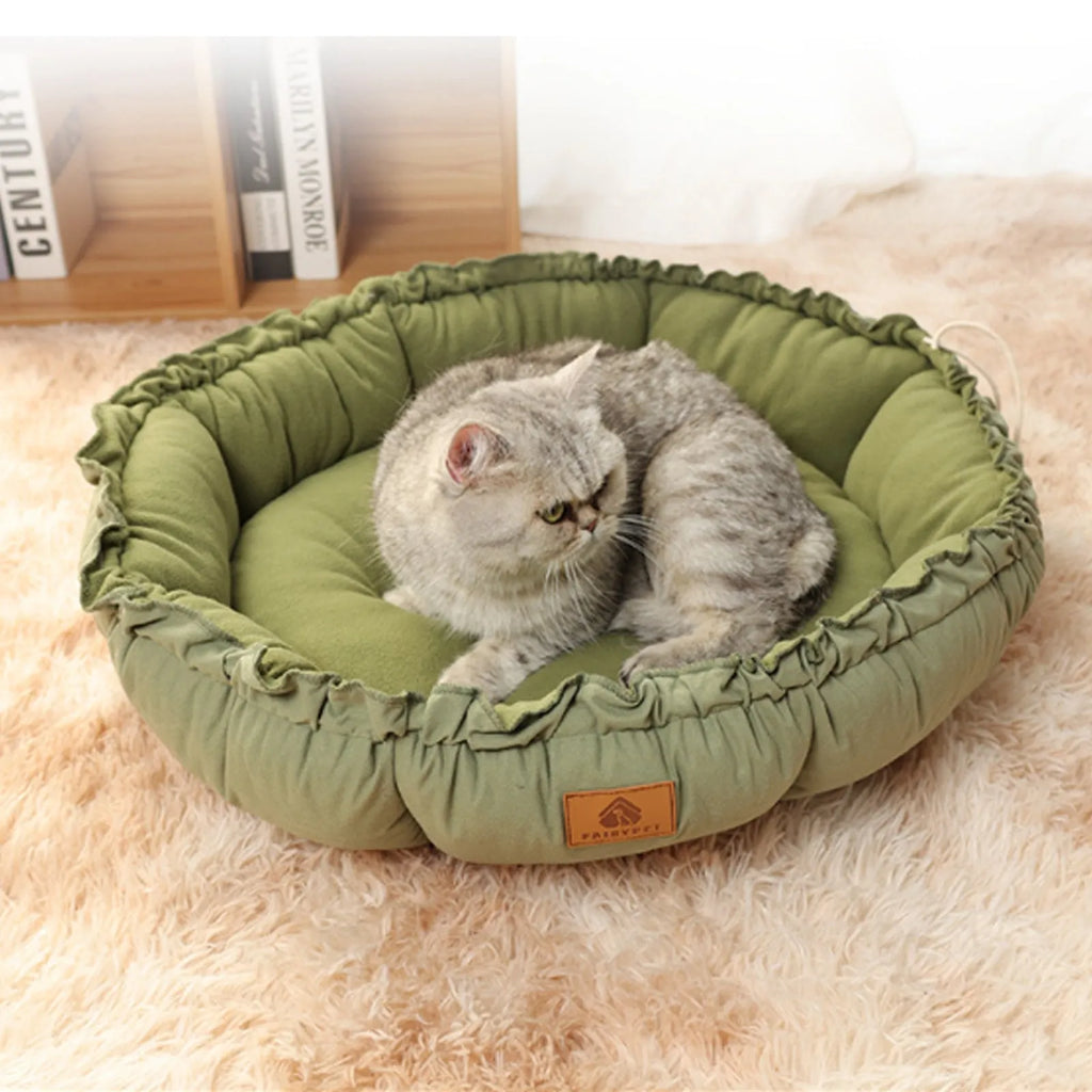 Grey and green reversible donut cat bed shown in three sizes for indoor cats and small dogs