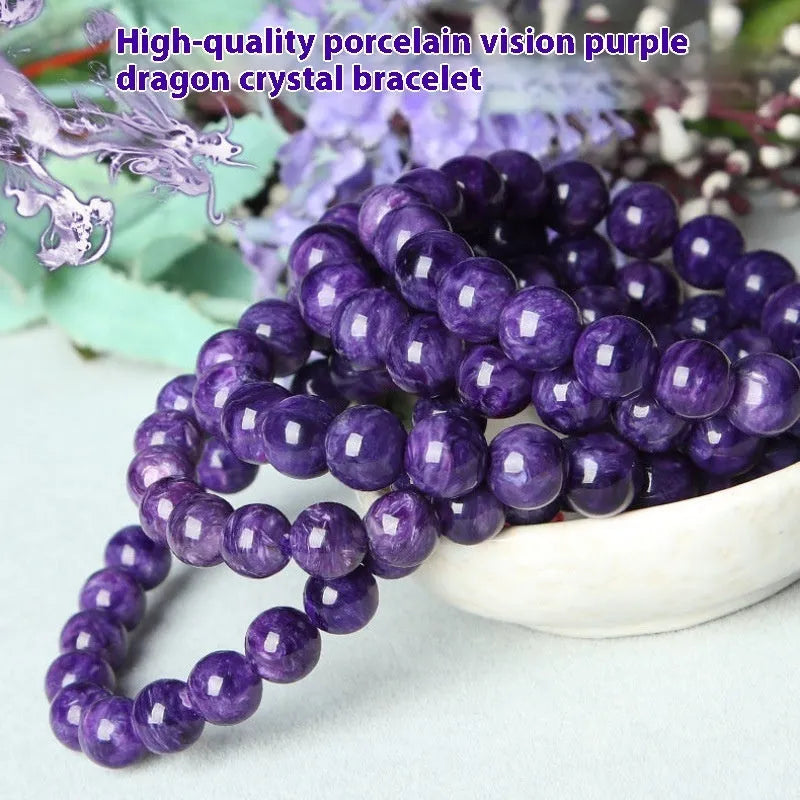 Natural transparent charoite hands design bead bracelet with platinum setting on a wrist.
