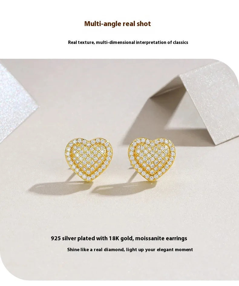 Heart-shaped moissanite stud earrings in gold-plated silver with minimalist design