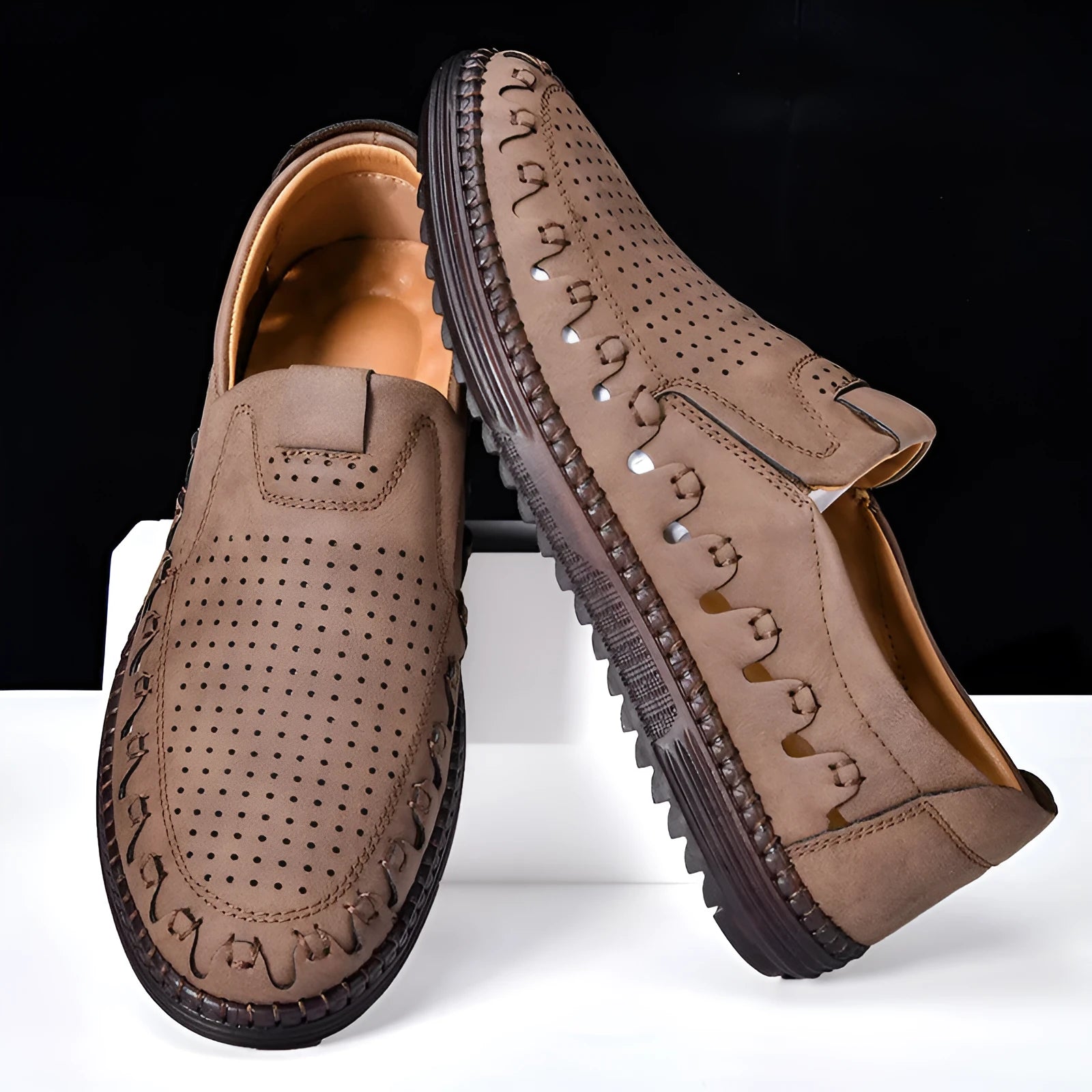 Men's brown casual slip-on shoes with round toe and low-top design showing sewing line details on PVC sole