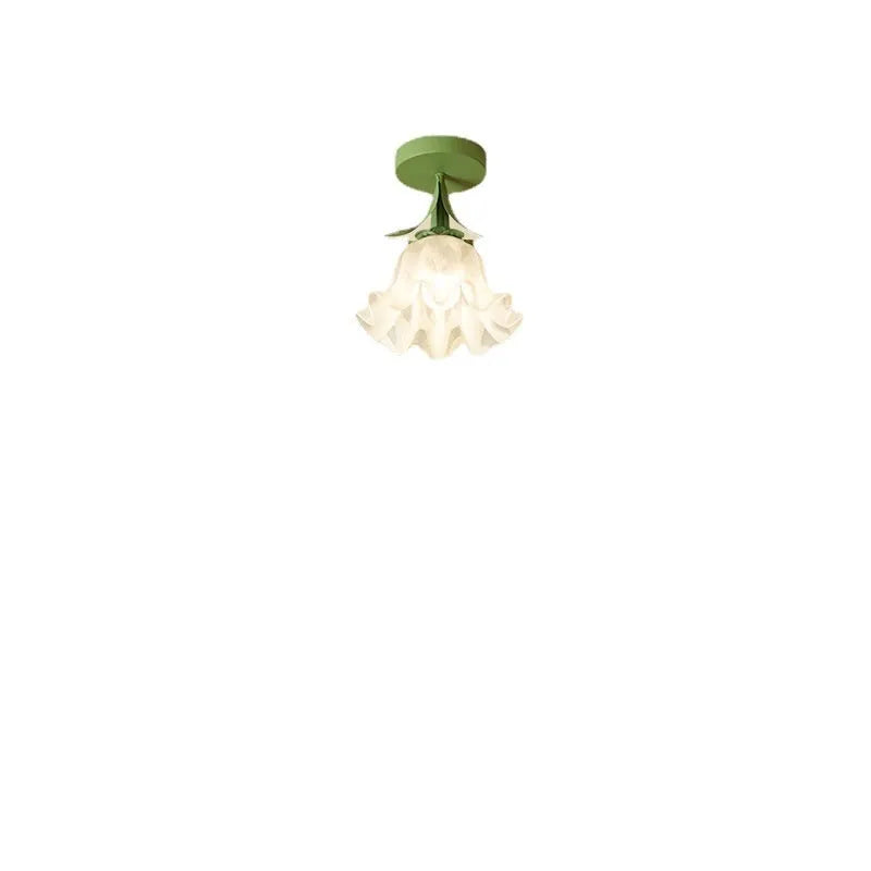 Cream coloured Linglan flower modern corridor wall light fixture on display.