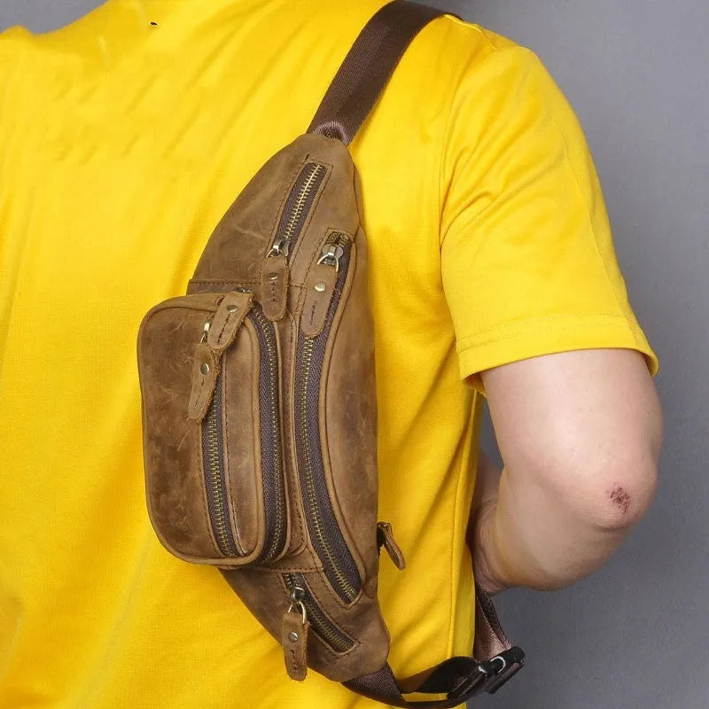 Brown leather shoulder messenger bag with adjustable strap showing interior compartments
