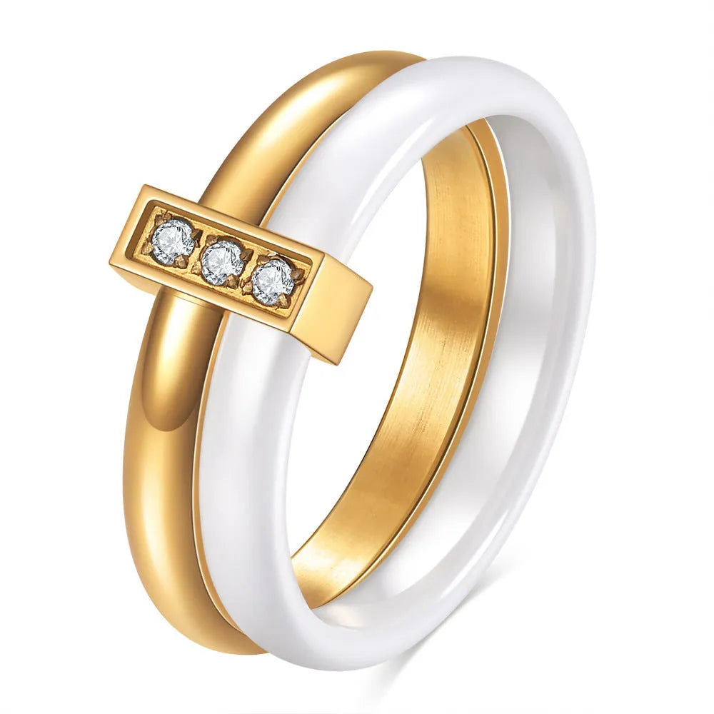 Geometric ceramic women's ring with glossy stitching and zirconium accents in steel black.