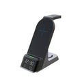 Black multifunctional alarm clock with integrated wireless charging pad and digital display.