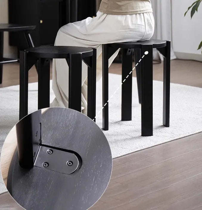 Stackable iron round dining stool in modern style, shown in one of four colour options.