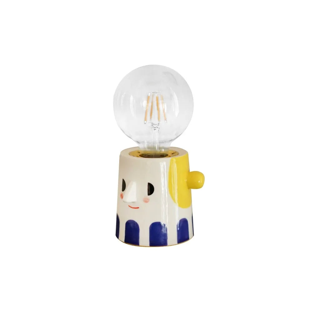 Handmade ceramic table lamp with a spherical ball headlight design on a solid ceramic base.