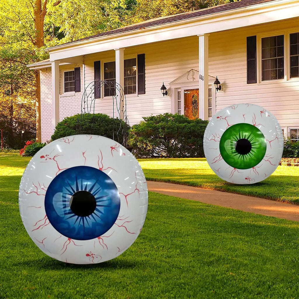 Green Halloween eyeball balloon with red bloodshot pattern, inflated to a round shape.