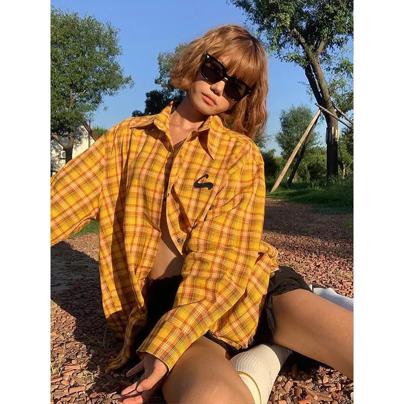 Dopamine yellow plaid shirt with a loose, cardigan-style fit on a hanger.