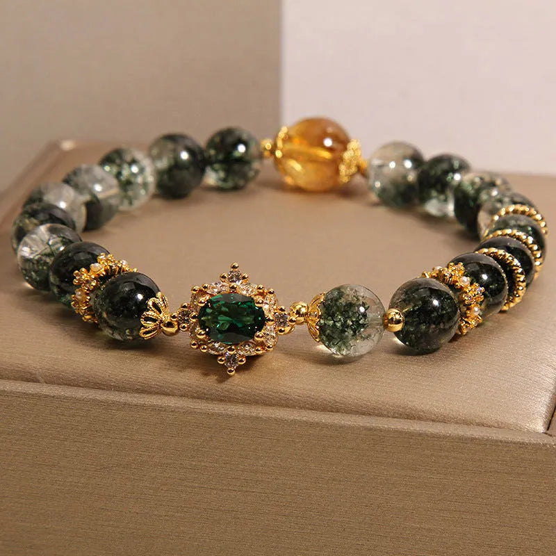 Gold rutilated quartz bracelet with green phantom quartz beads, gold ruby quartz accents, pearl and rhinestone details