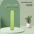 Green and grey dog detangling combs with stainless steel teeth, shown in large and small sizes.
