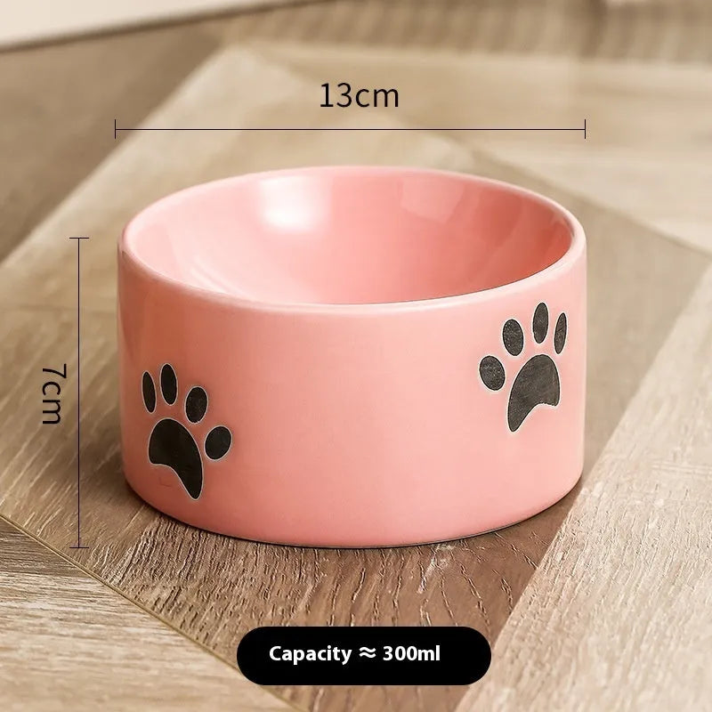Ceramic cat bowl with high foot design and oblique mouth in cat's paw pattern