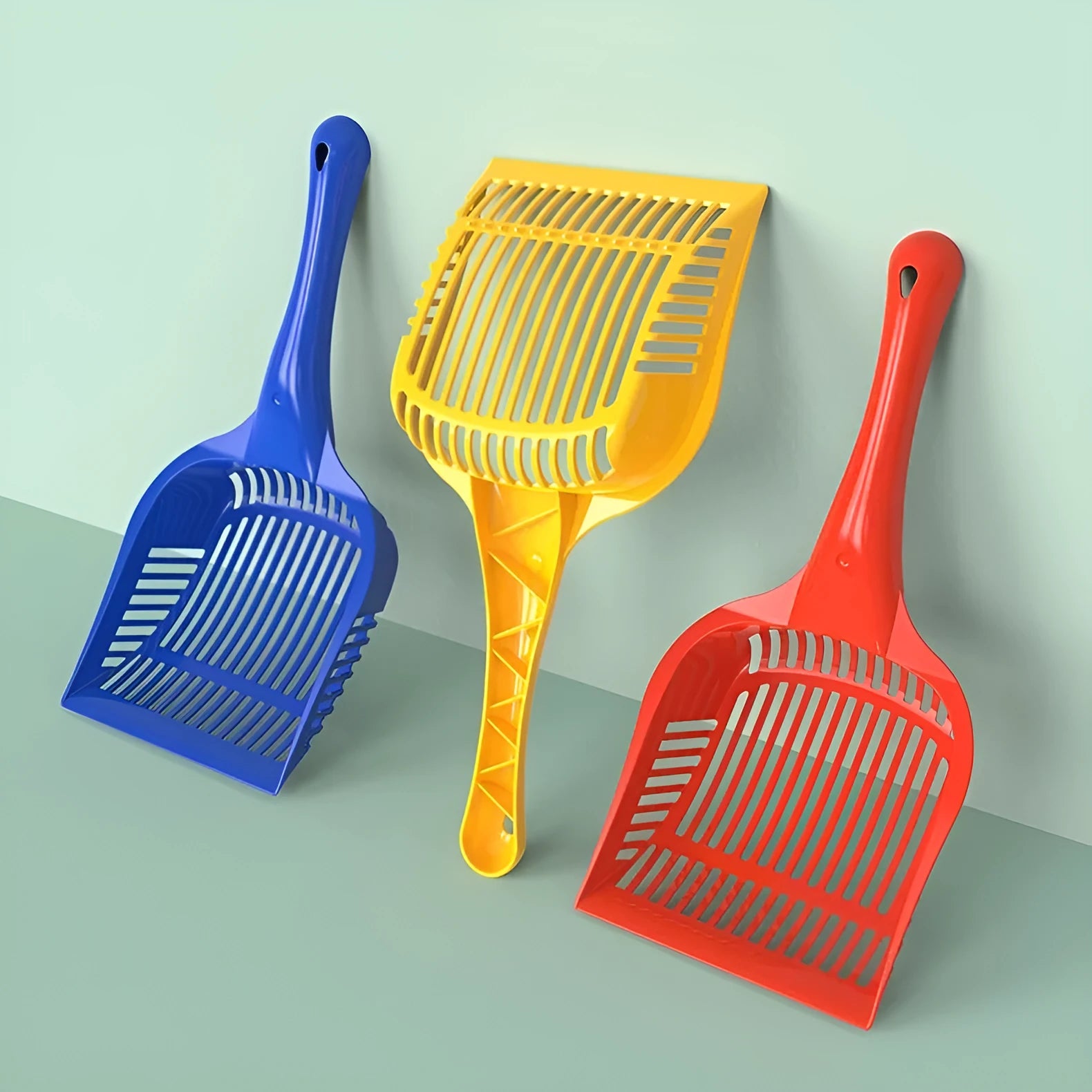 PP plastic cat litter scoop in red, yellow, and blue colours showing small and medium size options