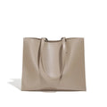 Brown genuine leather one shoulder handbag showing horizontal square shape and single strap.
