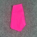 High-waisted women's yoga shorts in nylon fabric, shown in pink litchi colour.