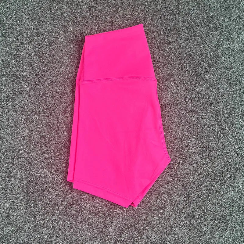 High-waisted women's yoga shorts in nylon fabric, shown in pink litchi colour.