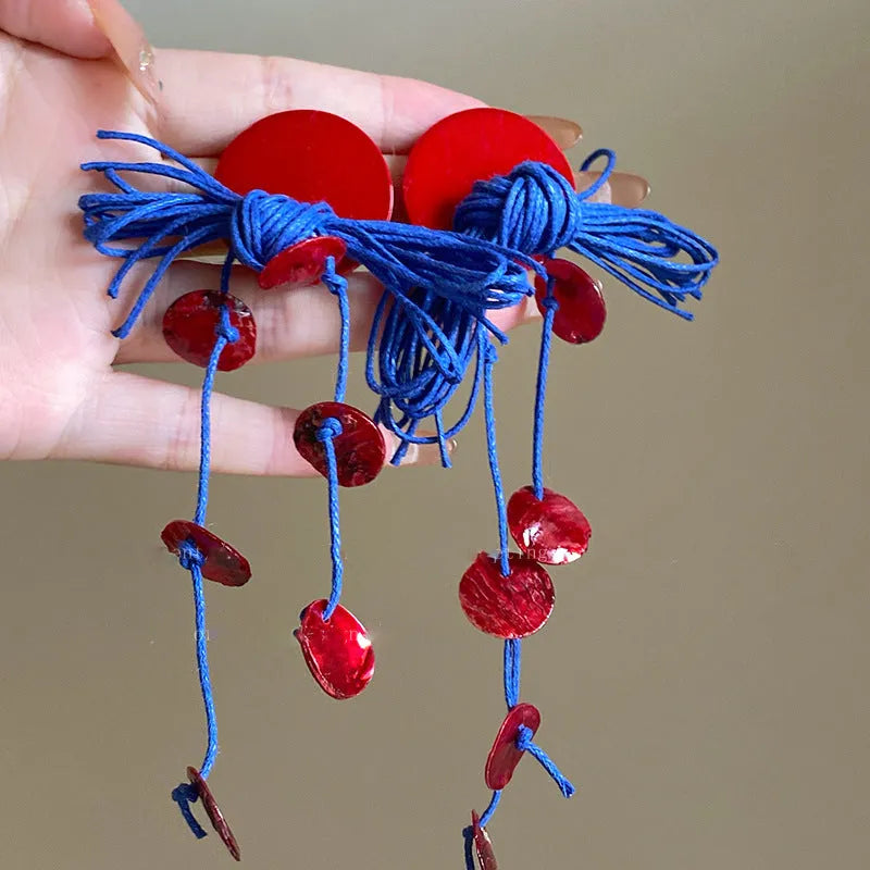 Geometric women's earrings with round elements in silver needle and blue resin flower colours on cloth base