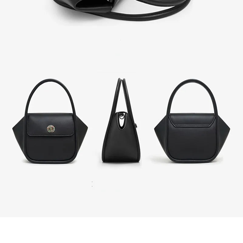 Women's leather wing tote bag in cow leather with a cross-body strap and buckle detail.
