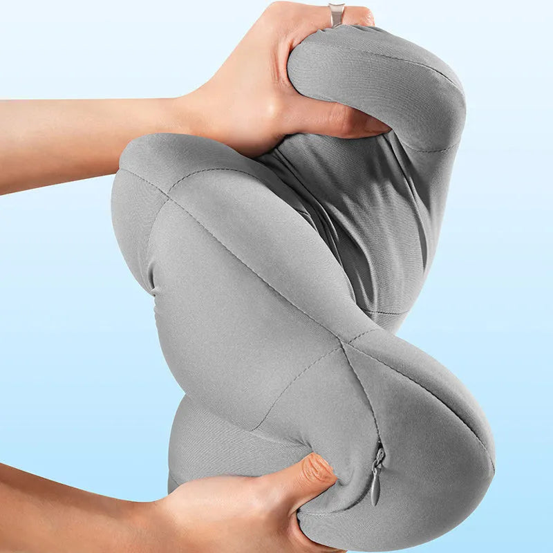 Grey and orange memory foam car headrest and lumbar support pillow set on a car seat.