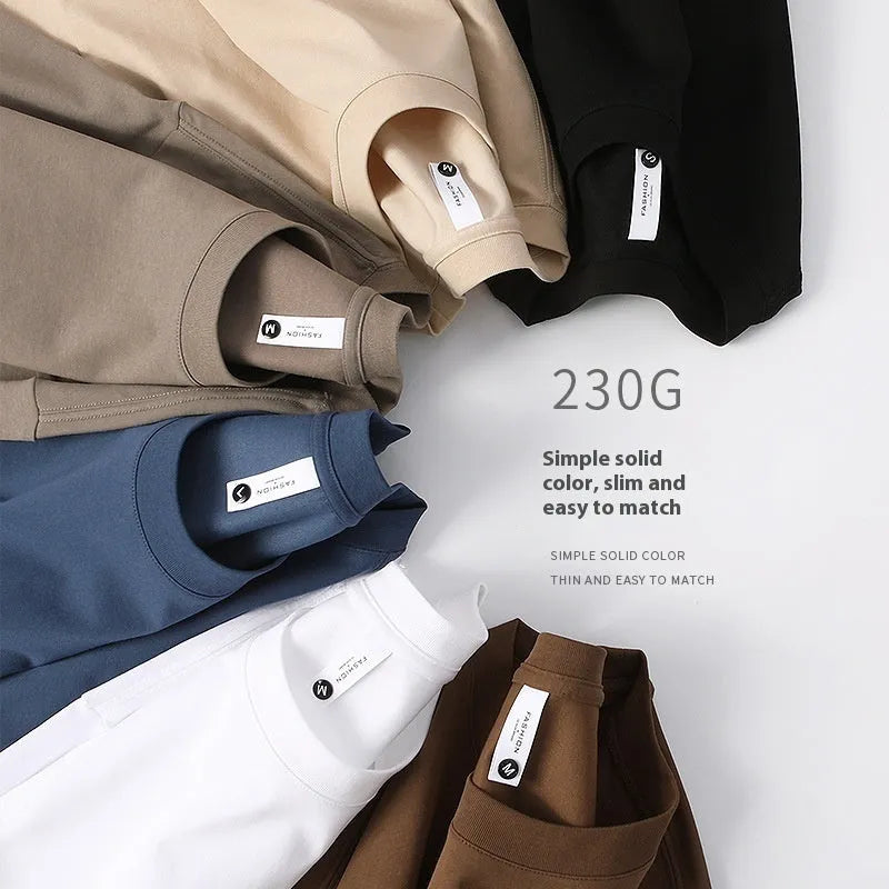 Heavy 230g cotton blend drop shoulder t-shirt in a solid colour, showing loose fit and short sleeves.
