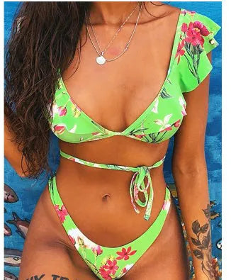 Yellow floral printed women's split bikini swimsuit on hanger showing front design