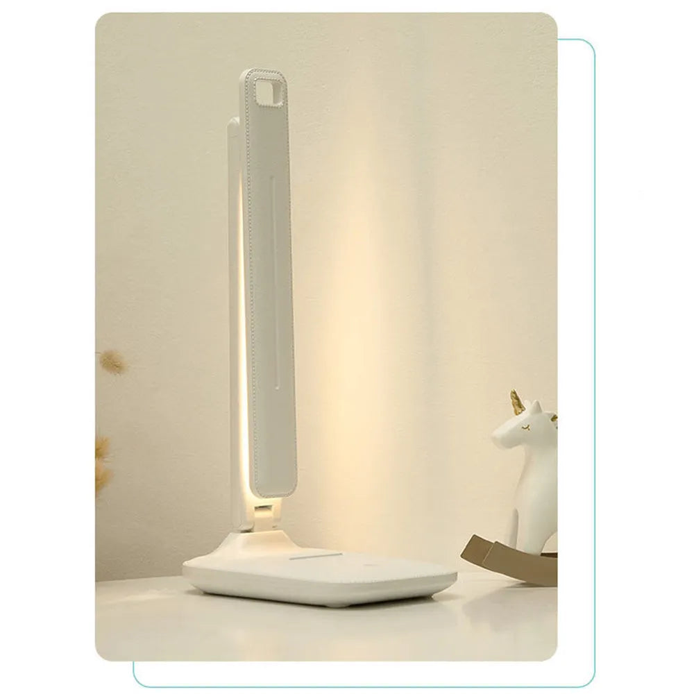 White plastic bedside lamp with touch dimming control and USB charging port