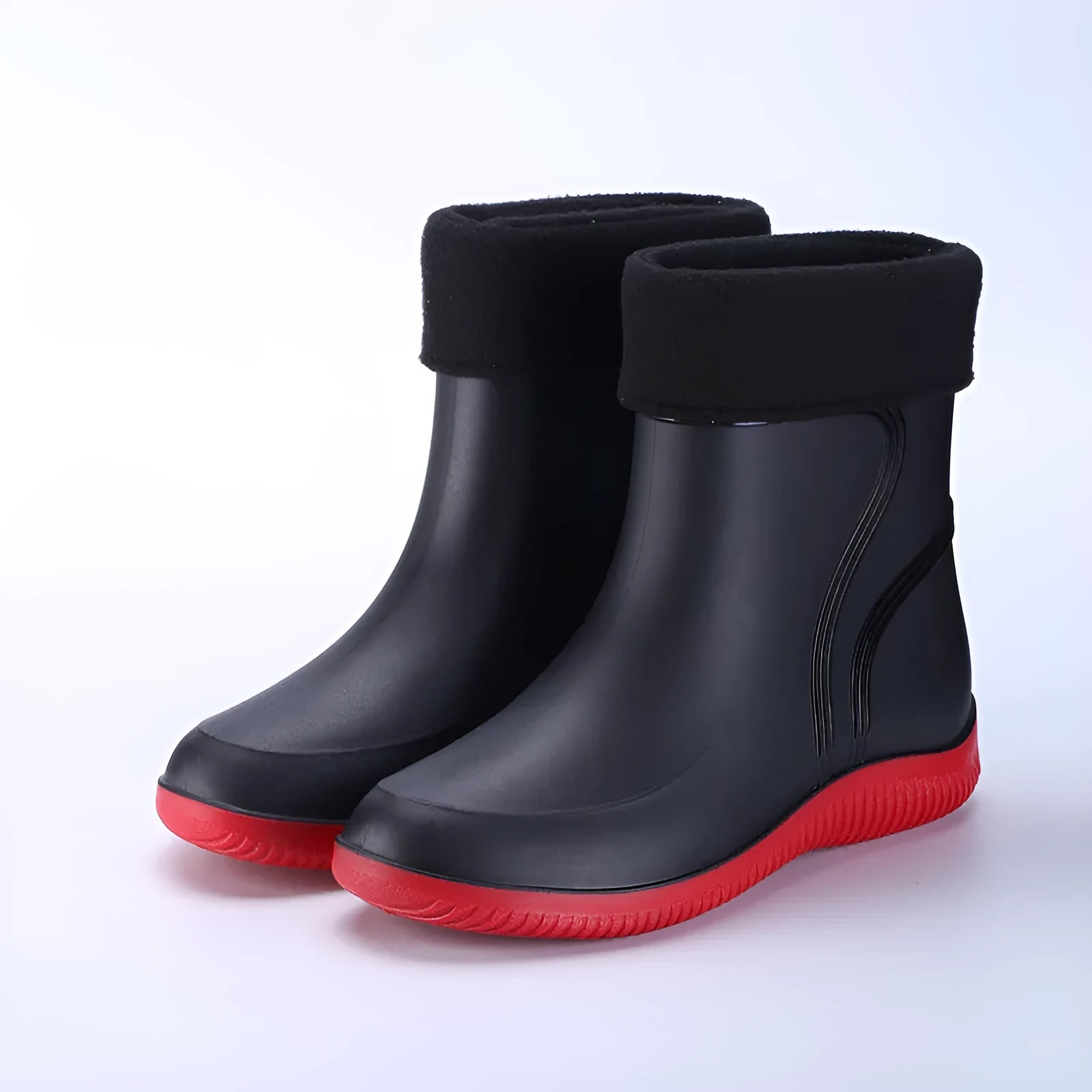 Men's mid-top PVC rain boots in black with green detailing, tassel decoration, and non-slip sole