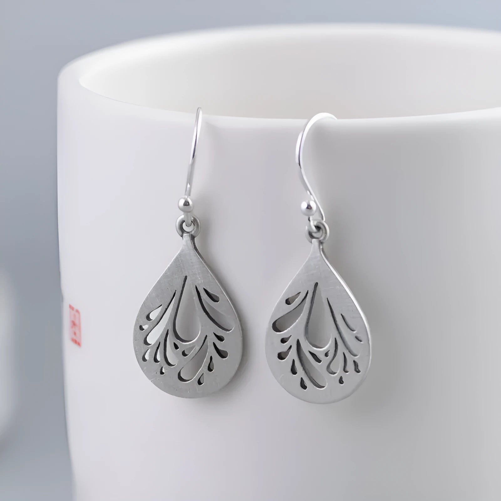 Pair of retro-style hollow water drop earrings made from 925 sterling silver