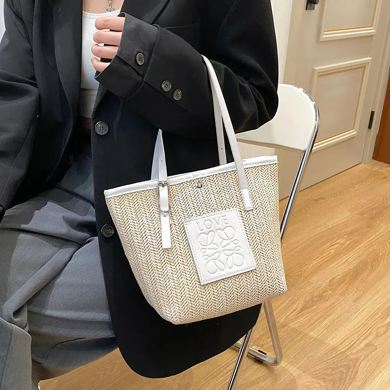 White straw woven women's shoulder bag with three-dimensional pockets showing European retro styling details