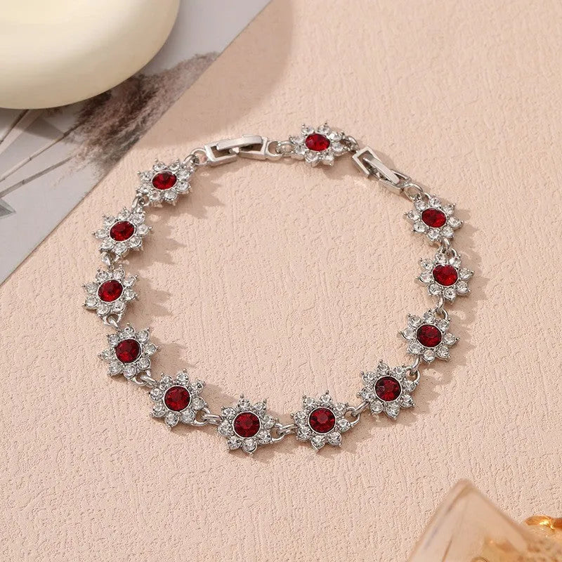Flower-shaped zinc alloy bracelet with electroplated finish and decorative stone details