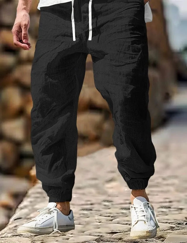 Men's straight-leg cotton trousers with an elasticated waistband in apricot colour