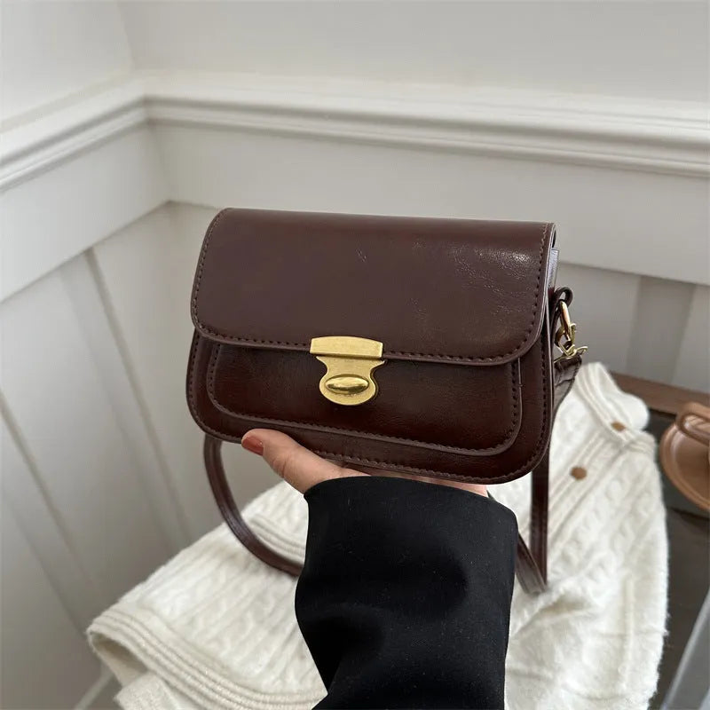Soft PU leather retro small square handbag in black, brown, dark brown, or light brown.