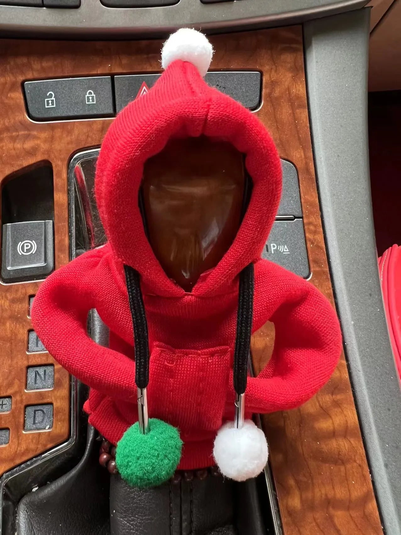 Cloth gear lever cover in hooded sweater design showing multiple style options