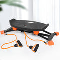 Black JS101A mini indoor fitness skiing machine with elastic hand straps on a flat surface.