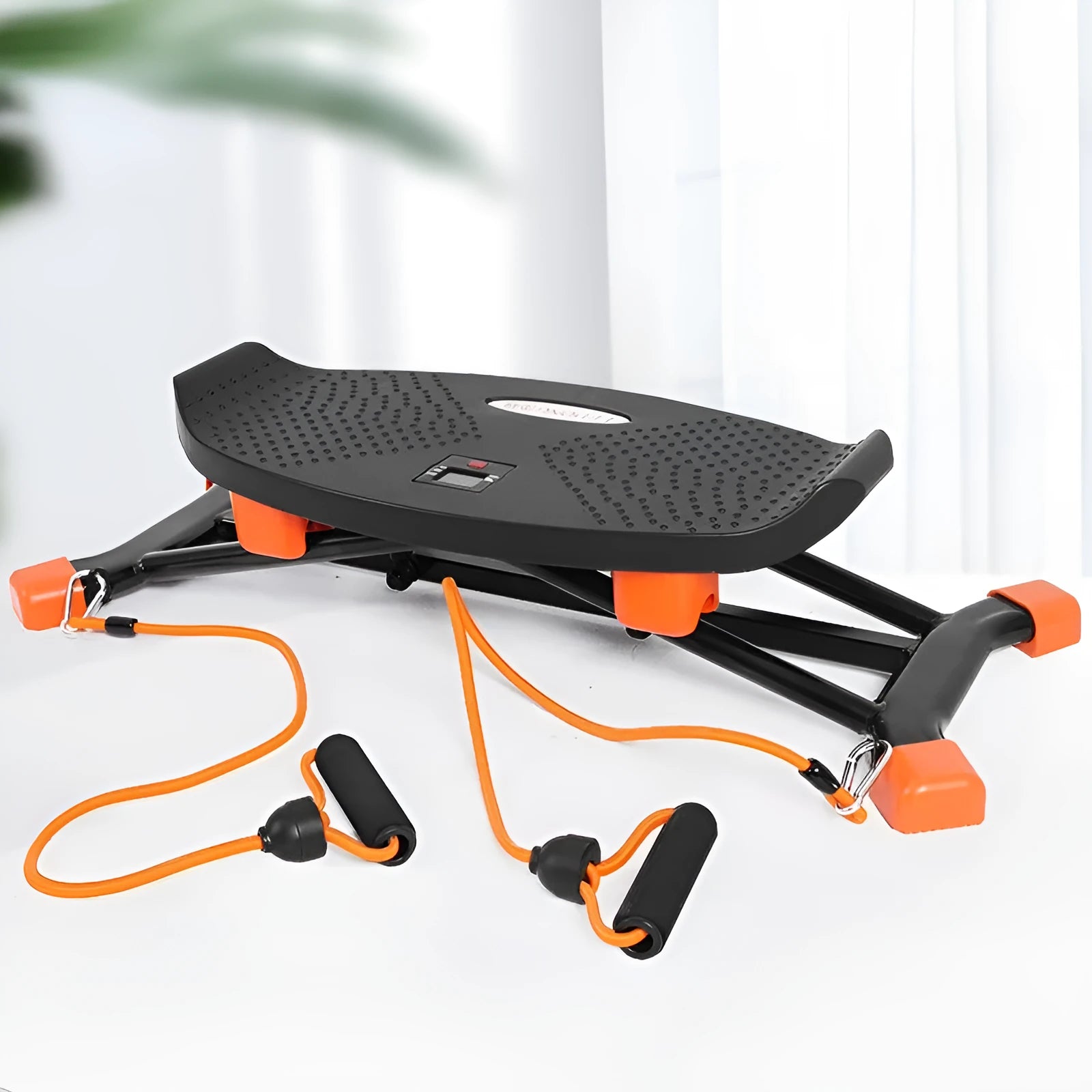 Black JS101A mini indoor fitness skiing machine with elastic hand straps on a flat surface.