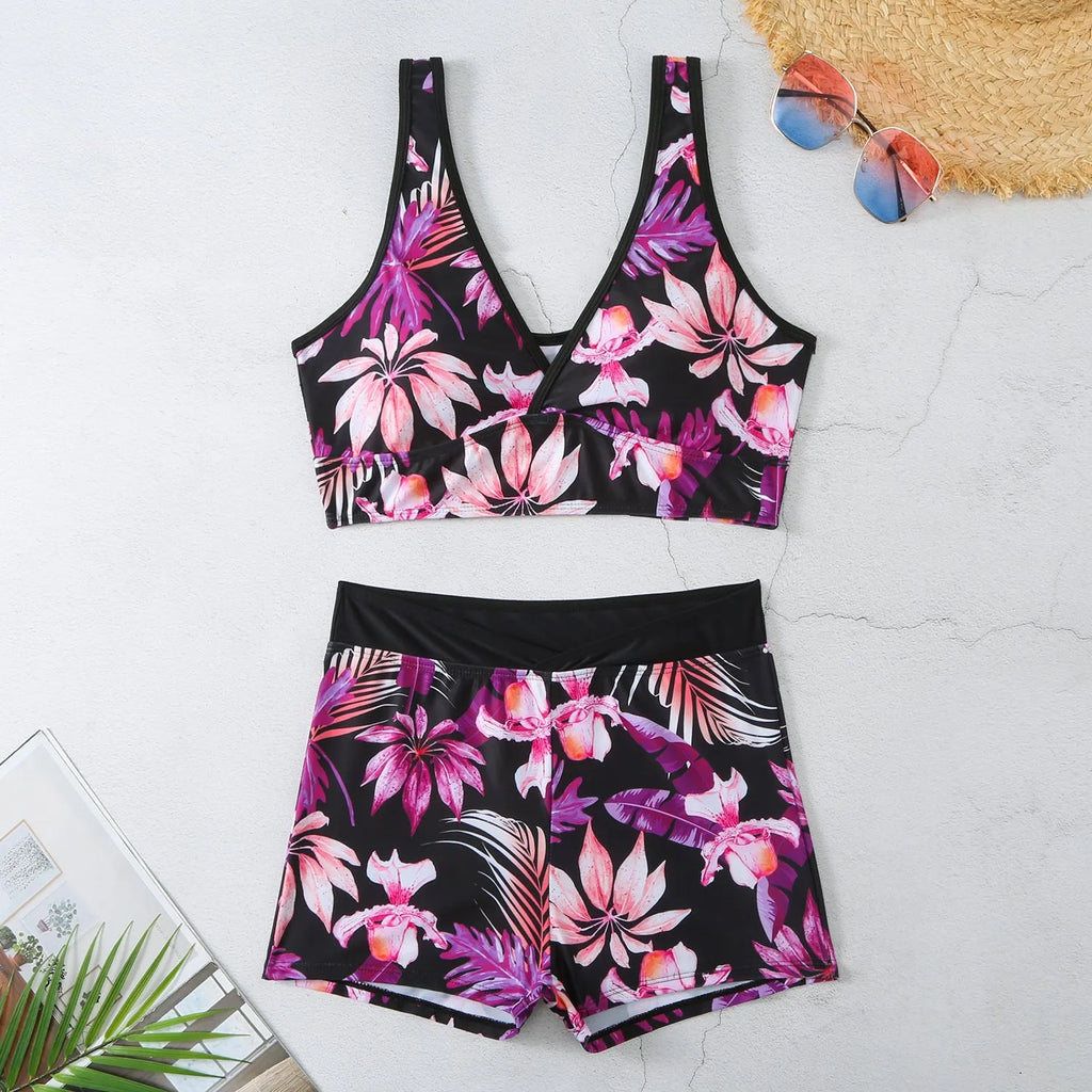 Women's two-piece printed boxer swimsuit set in polyester on a mannequin.