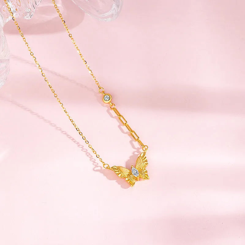 S925 sterling silver brushed butterfly necklace with asymmetric diamond detail on O-ring chain, yellow gold colour